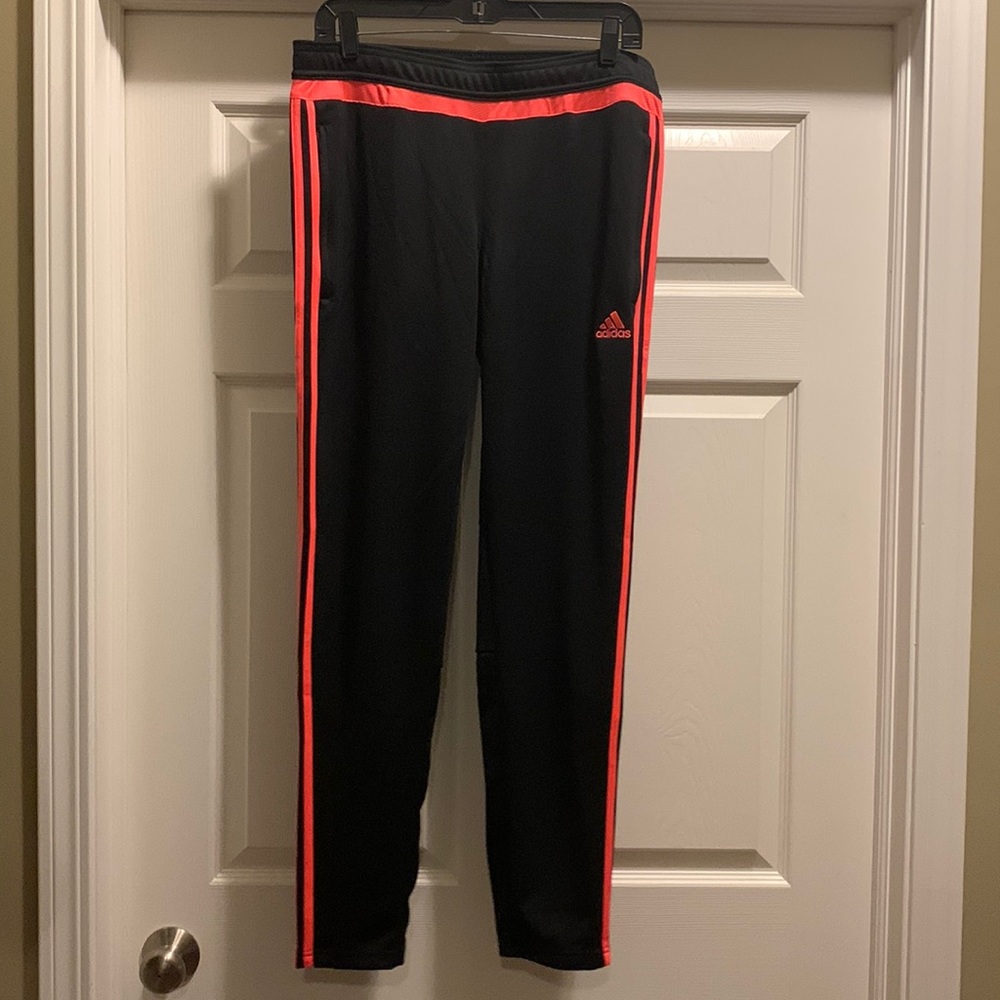 Like New - Black and orangish pink Adidas climate cool pants.